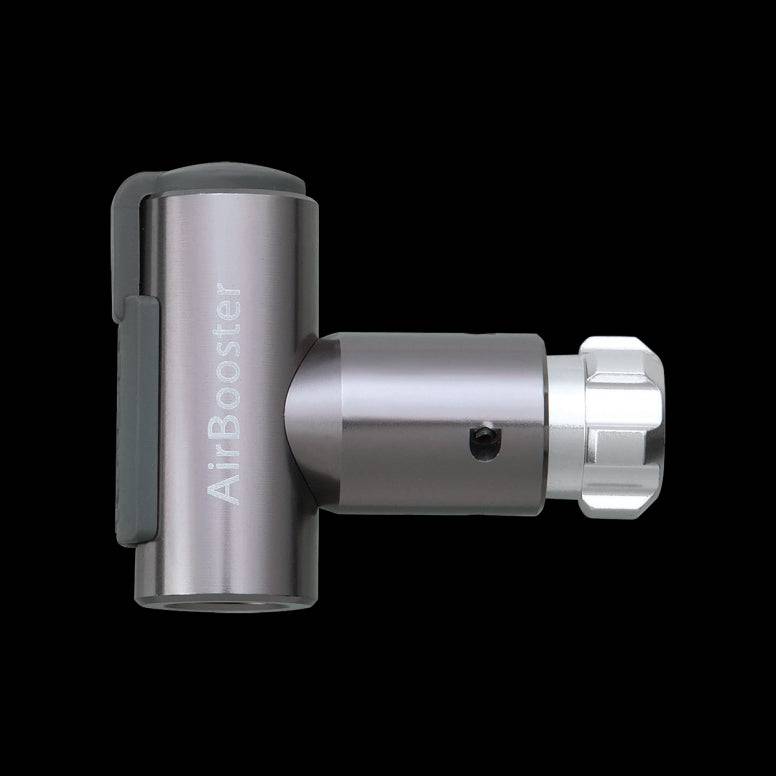 Topeak AirBooster Compact CO2 inflator for Presta and Schrader valves with dust cap, shown with nozzle and valve adapters.