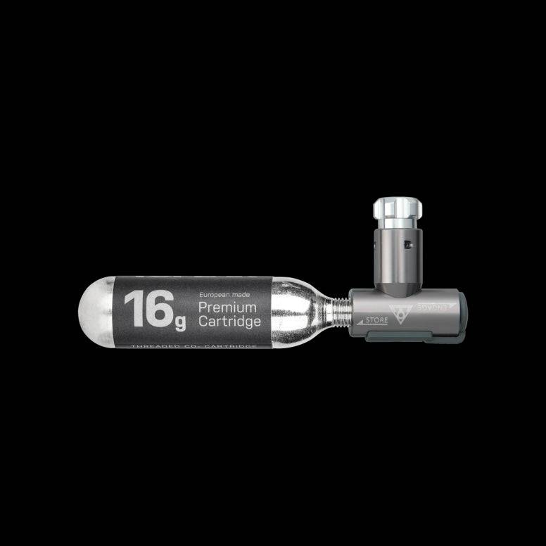 Topeak AirBooster Compact CO2 inflator for Presta and Schrader valves with dust cap, shown with attached valve connection.