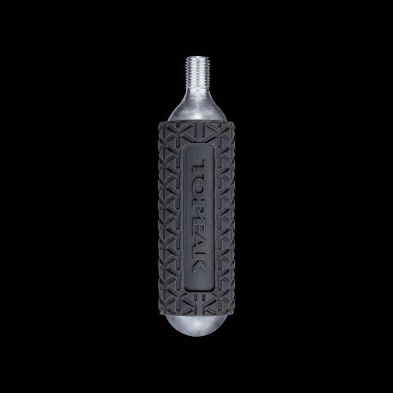 Pair of Topeak silicone CO2 cartridge sleeves for inflator protection, designed as durable accessories for bike inflators.