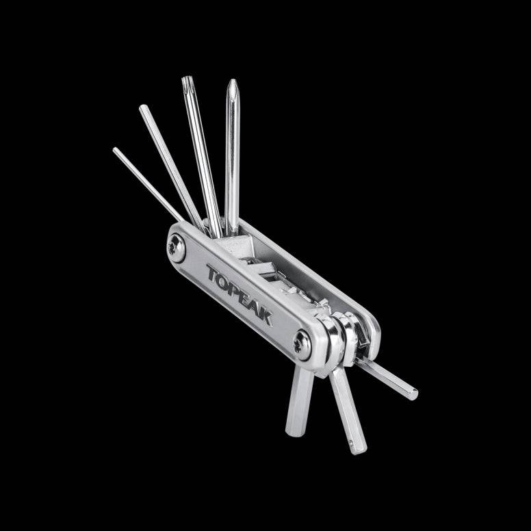 Topeak X-Tool+ 11-function compact folding bike multi-tool for cycling repairs, shown open with various tools extended.