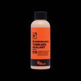 Orange Seal Endurance tubeless sealant for puncture protection, shown in a container, suitable for cold weather cycling components.