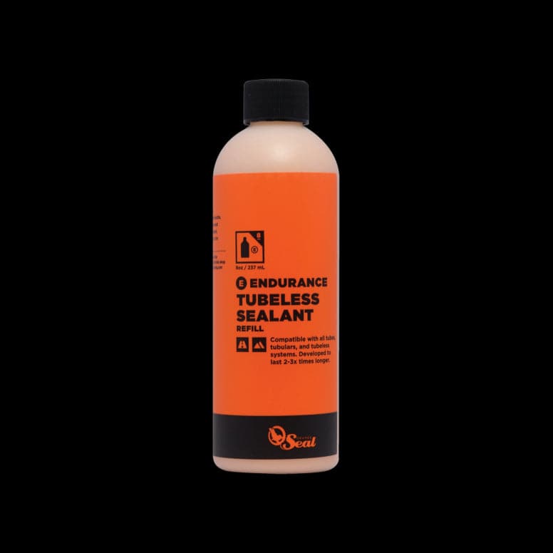 Orange Seal Endurance tubeless sealant for puncture protection and cold weather cycling, shown in a container.