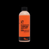 Orange Seal Endurance tubeless sealant for puncture protection and cold weather cycling, shown in a container.