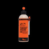 Orange Seal Endurance tubeless sealant for puncture protection and cold weather use, shown in a container with orange branding.