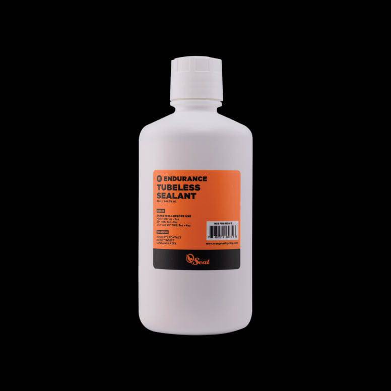Orange Seal Endurance tubeless sealant in a container, designed for puncture protection and cold weather cycling components.