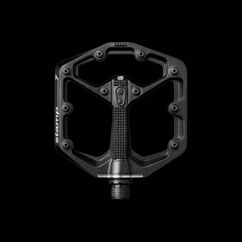 Crank Brothers Stamp 7 flat mountain bike pedal with adjustable pins, durable aluminum body, and clipless-compatible design.