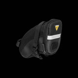 Topeak Aero Wedge Strap Mount bike seat pack with pump holder and reflective strips, designed for cycling accessories.