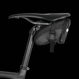 Topeak Aero Wedge Strap Mount bike seat pack with pump holder and reflective strips, designed for secure cycling accessory storage.