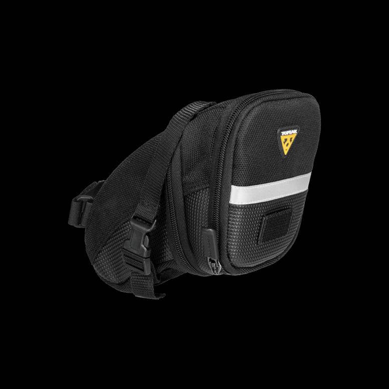 Topeak Aero Wedge Strap Mount bike seat pack with pump holder and reflective strips, designed for secure attachment and visibility.