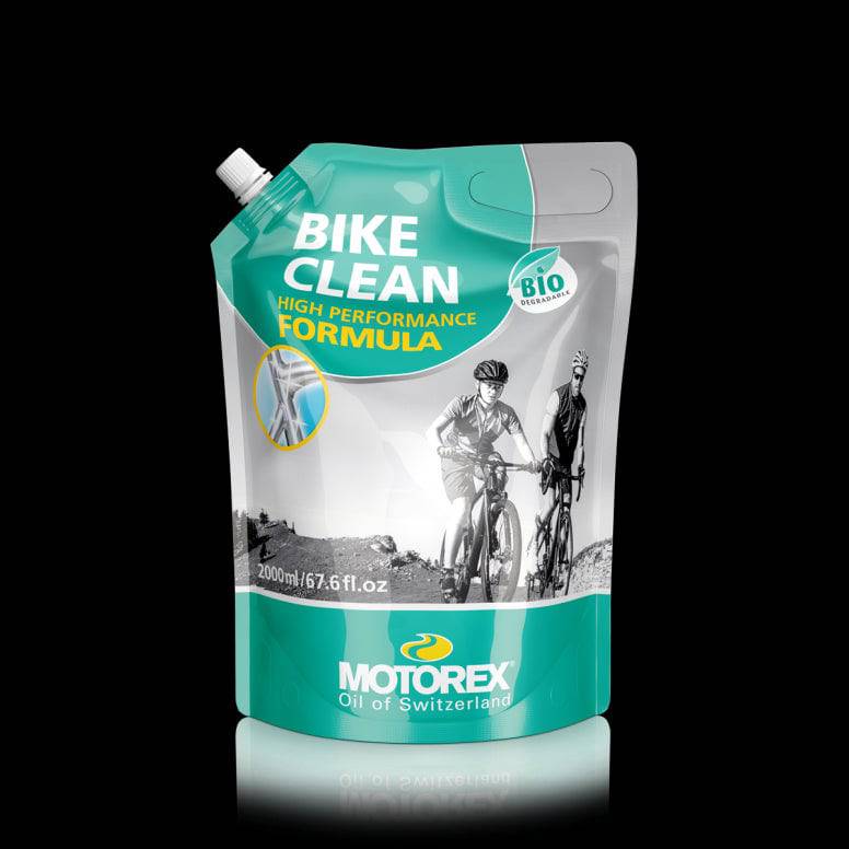 Motorex Workshop Bike Cleaner, biodegradable and solvent-free, showing a spray bottle and bike parts during cleaning.