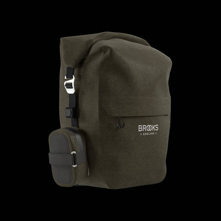 Brooks Scape waterproof pannier with Klick Fix attachment mounted on a bike rack, designed for secure bike gear storage.