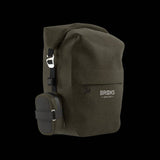 Brooks Scape waterproof pannier with Klick Fix attachment mounted on a bike rack, designed for secure bike gear storage.
