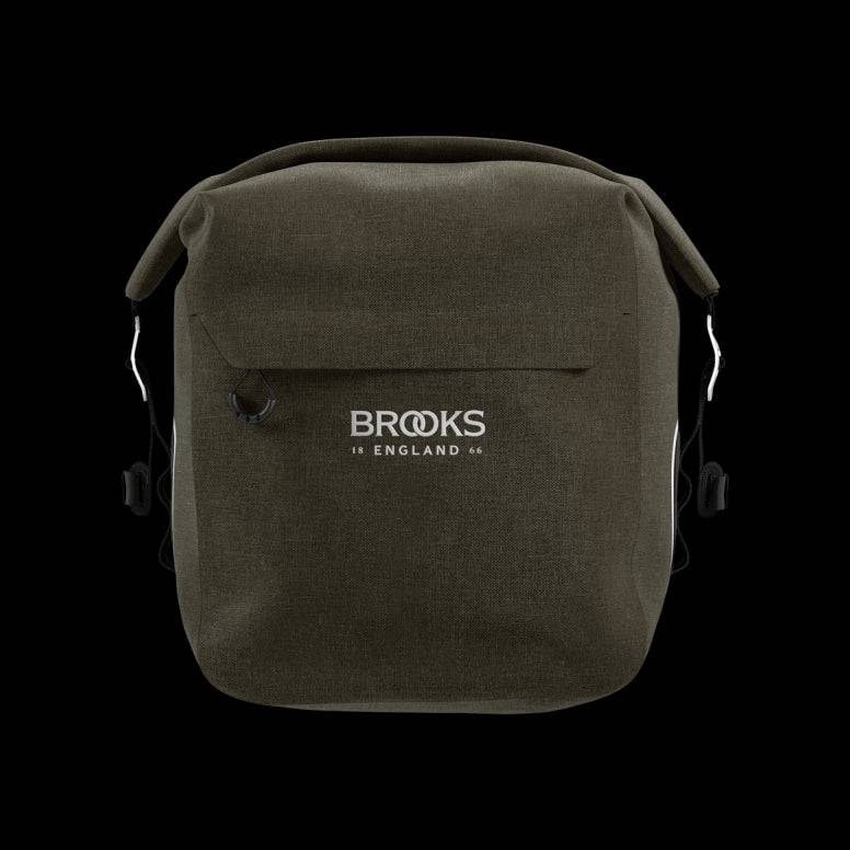 Brooks Scape waterproof bike pannier with Klick Fix attachment, designed for bike racks, in durable black with reflective details.