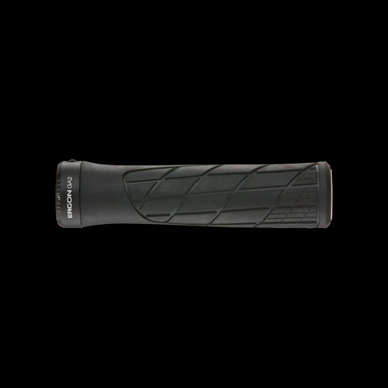 Ergon GA2 mountain bike grips with ergonomic design and carbon-friendly clamps, close-up of textured rubber grip surface.