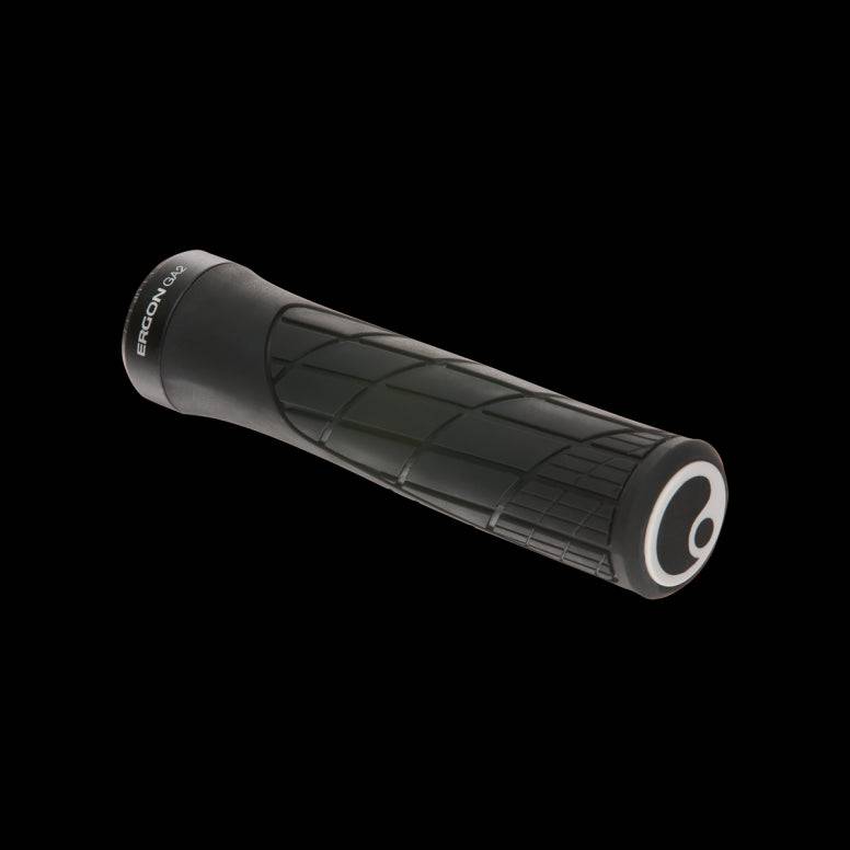 Ergon GA2 mountain bike grips with ergonomic design and carbon-friendly clamps, showcasing their textured rubber surface and secure fit.