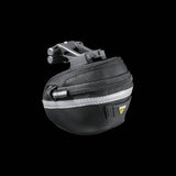 Topeak Wedge II Black Micro Bike Seat Pack with quick release mount and reflective strips attached to a bike saddle.