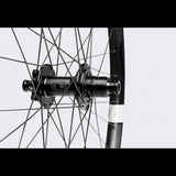 Crankbrothers Synthesis Alloy Enduro MTB rear wheel with i9 hub, 32 spokes, and durable alloy construction for mountain biking.