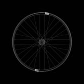 Crank Brothers Synthesis Alloy XCT rear mountain bike wheel with I9 hub, showing the black alloy rim and quick-release skewer.