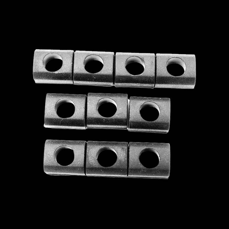 Set of 10 black Orange Seal square grommets for tubeless valve sealing, durable components for bicycle wheel maintenance.