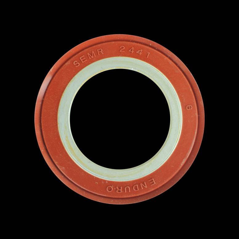 Enduro Bearings outboard cup seal for Shimano bottom brackets in silver and red, showing detailed close-up of the component.