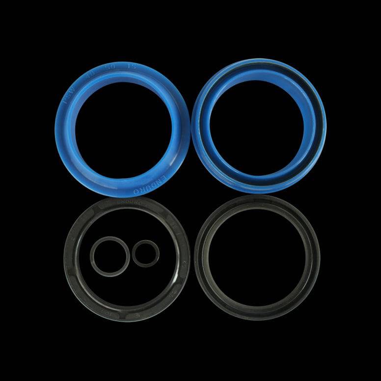 Enduro Bearings fork seals for Fox forks, durable dual-lip suspension seals, close-up of the component in black and silver.