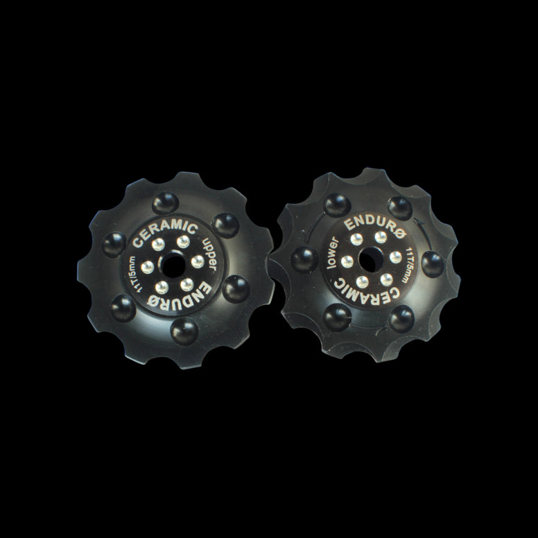 Enduro Bearings Zero Ceramic Jockey Wheels for Shimano, SRAM, Campagnolo drivetrain components, with black ceramic rollers and metal frame.