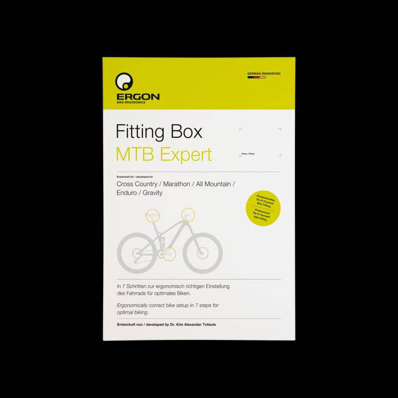 Ergon fitting box bike adjustment kit with saddle, handlebar, and pedal components for improved cycling comfort.