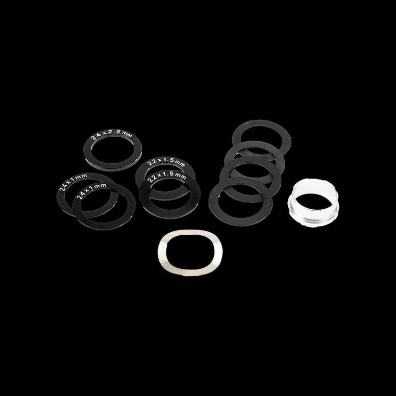 Enduro Bearings spacer kit for SRAM GXP and DUB bottom brackets, featuring various metal spacers for bike component installation.