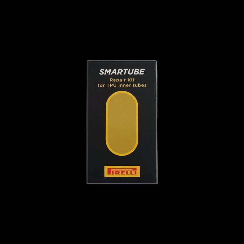 Pirelli SmarTUBE bicycle tube patch kit with glue and 10 yellow patches, components for bike tire repair.