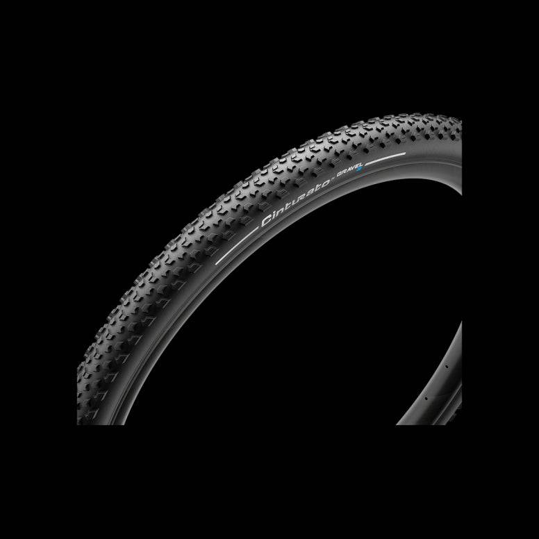 Pirelli Cinturato Gravel S tubeless-ready bike tire with high grip tread for gravel biking, shown mounted on a gravel bike wheel.