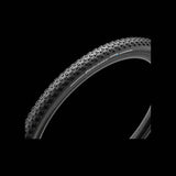 Pirelli Cinturato Gravel S tubeless-ready bike tire with high grip tread for gravel biking, shown mounted on a gravel bike wheel.