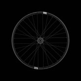 Crank Brothers Synthesis Alloy Enduro Rear Wheel with CB hub mounted on a mountain bike for off-road riding.