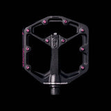 Crank Brothers Stamp 7 black and pink flat MTB pedal with adjustable pins, lightweight bike component for mountain biking.