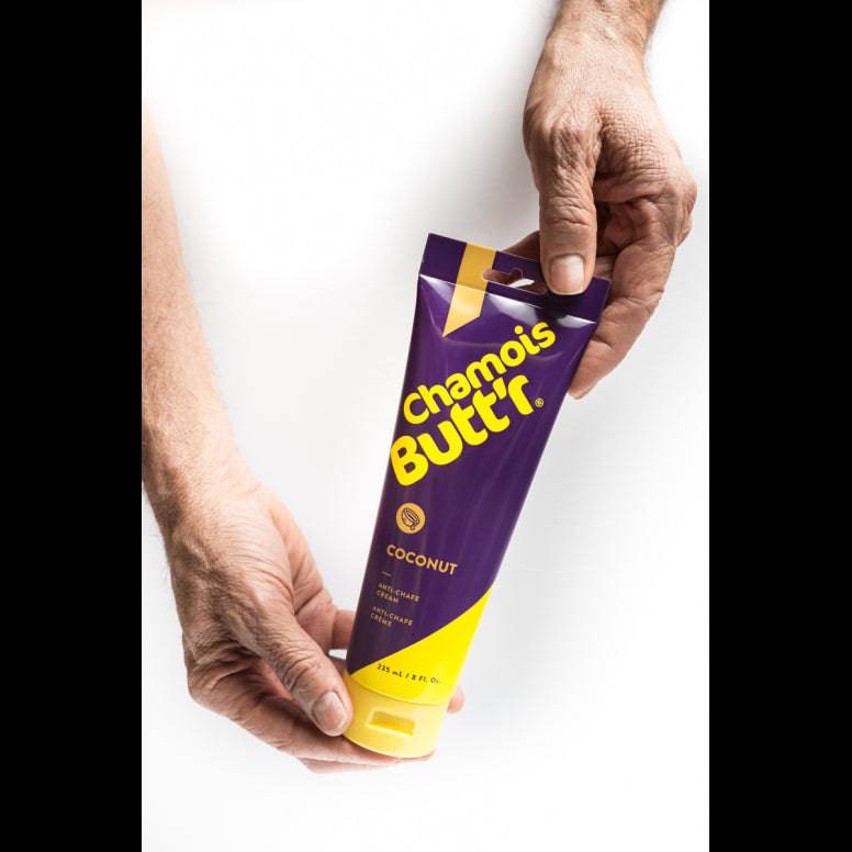 Chamois Butt'r Coconut organic chamois cream for cycling and athletic comfort, shown in a tube with coconut flavor branding.