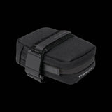 Topeak Elementa seatbag compact bike saddle bag with tools and inner tubes, mounted on a bike saddle for cycling accessories.