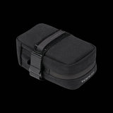 Topeak Elementa seatbag attached to a bike saddle, compact bike saddle bag for tools and inner tubes, black accessory for cycling.