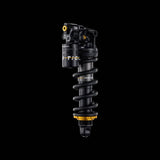 Cane Creek Tigon Coil trunnion rear shock with air-charged coil and RAMP tube technology for mountain bike suspension.