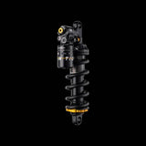 Cane Creek Tigon Coil Rear Shock with RAMP Tube Technology for trail bikes, showcasing the suspension component with coil spring and branding.