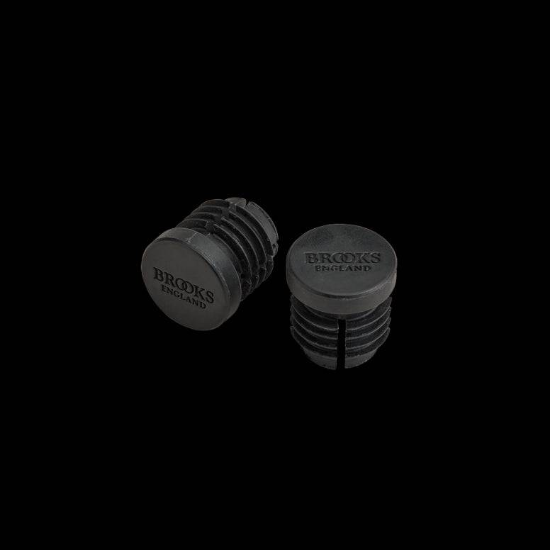 Brooks rubber bar end plugs for handlebar tape sealing and protection on bicycle handlebars.