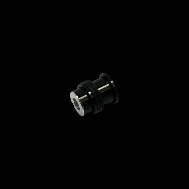 Cane Creek Double Barrel damper mounting hardware for rear shock, showing metal components and hardware parts for bike suspension.