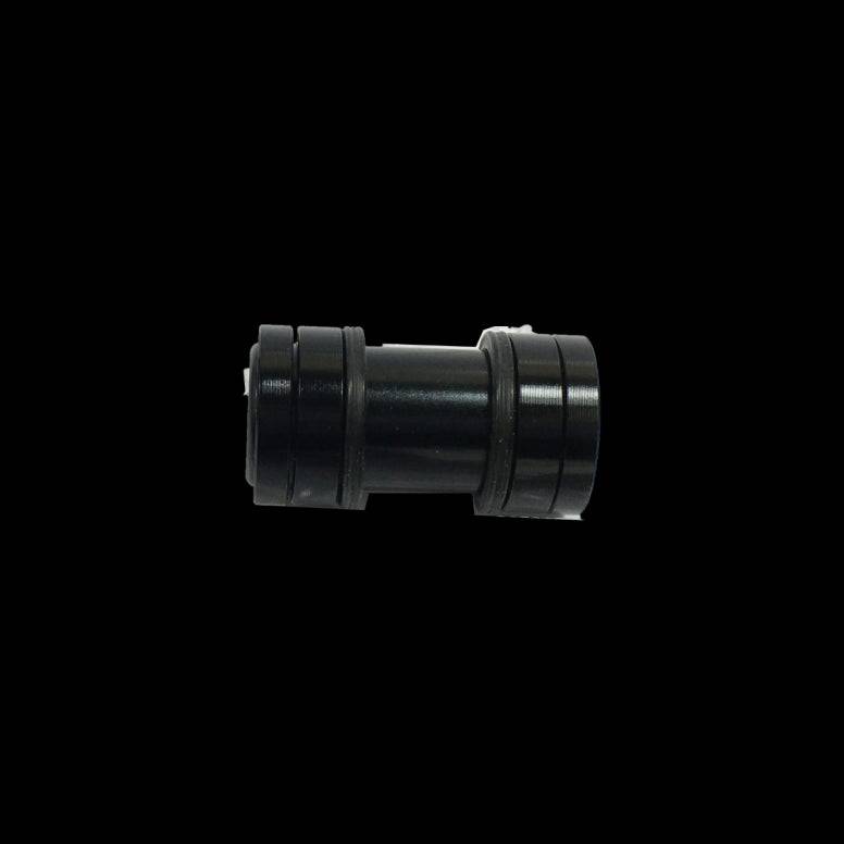 Cane Creek Double Barrel damper mounting hardware for rear shock, showing detailed metal components and assembly parts.