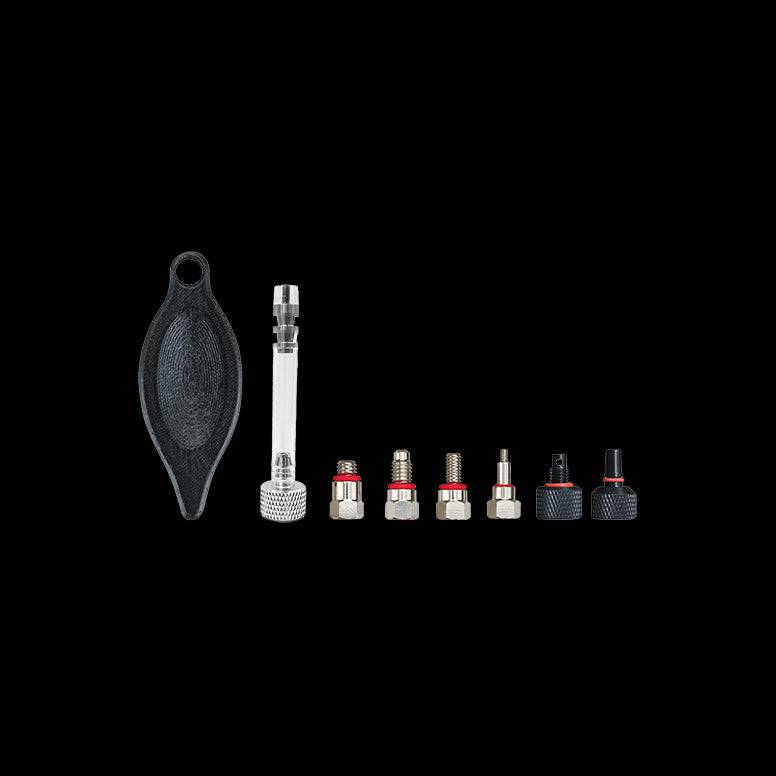 Jagwire Pro bleed kit replacement fittings for Shimano, Tektro, and Magura mineral oil brake systems, shown in a workshop setting.