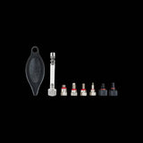 Jagwire Pro bleed kit replacement fittings for Shimano, Tektro, and Magura mineral oil brake systems, shown in a workshop setting.