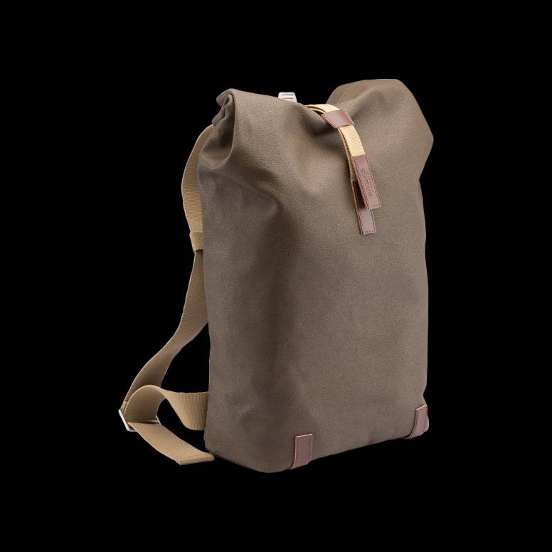 Brooks Pickwick roll-top backpack with laptop sleeve, ideal for urban cycling and commuting, featuring durable accessories and adjustable straps.
