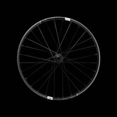 Crankbrothers Synthesis DH11 carbon front wheel for downhill mountain bike racing, showcasing lightweight construction and sleek design.
