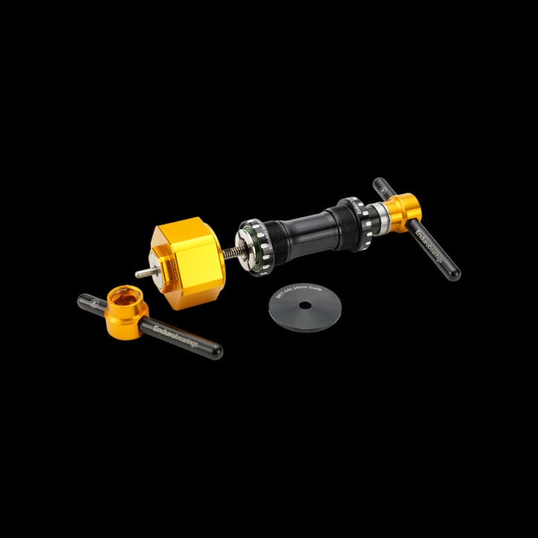 Enduro Bearings BRT-040 workshop tool kit for bearing removal and installation, black and gold color, includes hub and bearing tools.