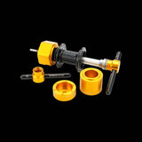 Enduro Bearings BRT-040 hub tool kit in black and gold for bearing removal, shown with various workshop tools and components.