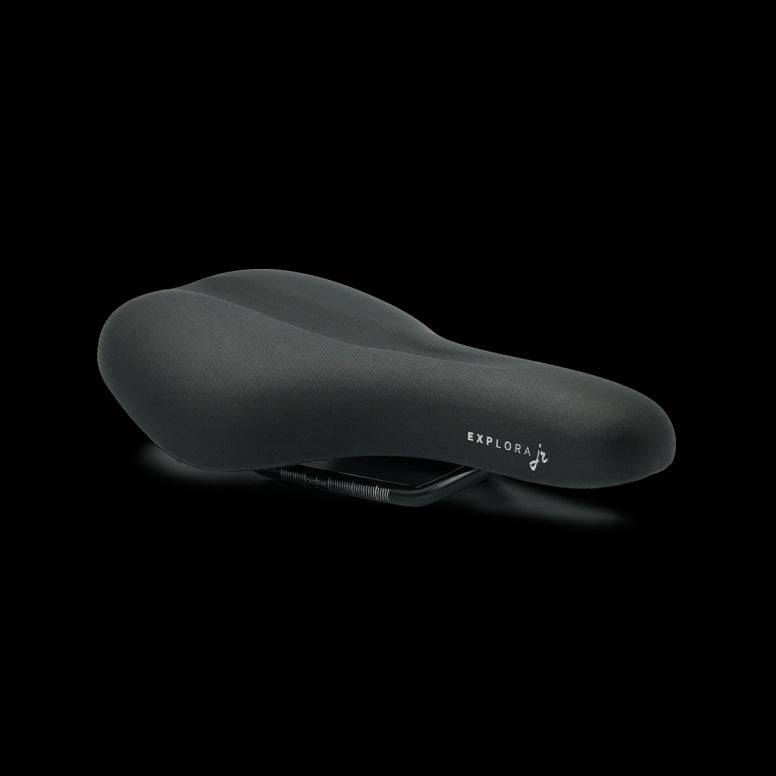 Selle Royal Explora Junior bike saddle with waterproof cover, cushioned seat, and clip system for kids’ bicycles.