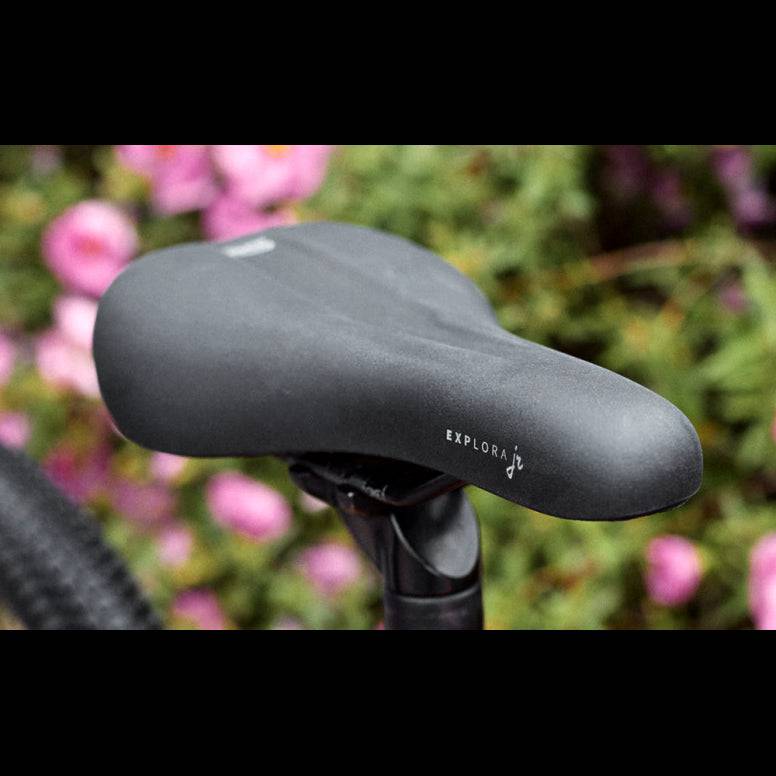 Selle Royal Explora Junior bike saddle with waterproof cover, comfortable padding, and clip system for children's bikes.