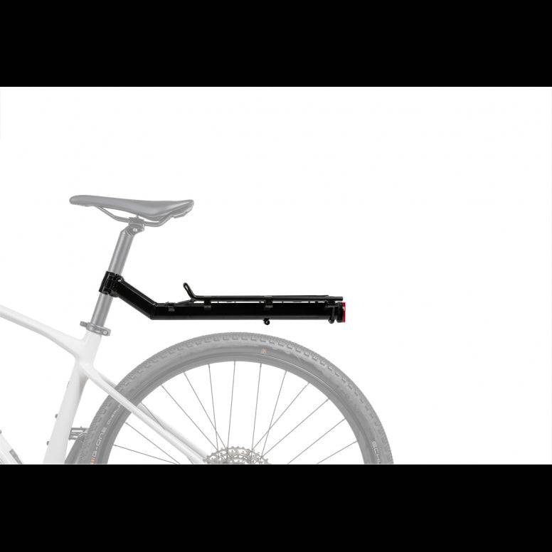 Topeak MTX Beam Rack for 29-inch MTB and gravel bikes with QuickTrack system, mounted on the bike's rear for carrying gear.